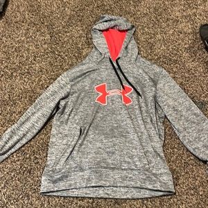 Under armor, gray with pink logo and pink in the inside of the hood